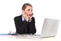 Businesswoman sitting at office desk working with laptop in stress looking upset Royalty Free Stock Photo