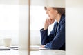 Businesswoman sitting reading a document