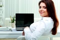 Businesswoman sitting at the table on her workplace Royalty Free Stock Photo