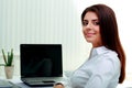 Businesswoman sitting at the table on her workplace Royalty Free Stock Photo