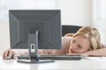 Businesswoman Sleeping At Computer Desk
