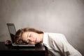 Businesswoman sleeping on laptop Royalty Free Stock Photo