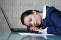 Businesswoman sleeping on laptop Royalty Free Stock Photo