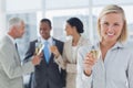 Businesswoman smiling at camera holding champagne Royalty Free Stock Photo