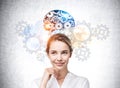 Businesswoman smiling portrait, gears and colourful brain sketch on grey wall Royalty Free Stock Photo