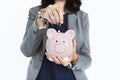 Businesswoman Smiling Putting Coin Piggy Bank Concept