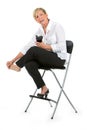 Businesswoman with sore feet sat on a chair