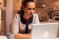 Businesswoman squinting eyes working on computer