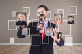 Businesswoman standing against blackboard with various formulas and icons Royalty Free Stock Photo