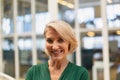 Businesswoman standing in the corridor at office Royalty Free Stock Photo