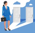 Businesswoman standing in front of two doors Royalty Free Stock Photo