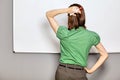 Businesswoman standing in front of whiteboard in office Royalty Free Stock Photo