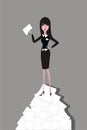 Businesswoman standing on the heap of paper