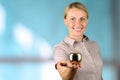 Businesswoman standing and holding golden apple in her hand. Royalty Free Stock Photo