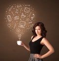 Businesswoman holding a white cup with social media icons Royalty Free Stock Photo