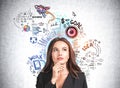 Businesswoman is standing near colourful sketch with light bulb, rocket