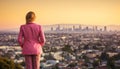 Businesswoman standing on rooftop, watching city life at sunset generated by AI