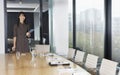 Businesswoman Standing At Table In Boardroom Royalty Free Stock Photo