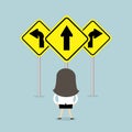 Businesswoman standing on three way arrows road sign. Royalty Free Stock Photo