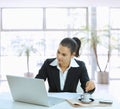 Businesswoman stirring coffee Royalty Free Stock Photo