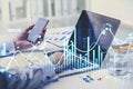 Businesswoman or stock trader analyzing stock graph chart by fibonacci indicator