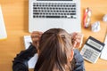 Businesswoman stressed and headaches while working on a computer