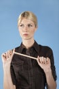 Businesswoman Stretching Rubber Band Royalty Free Stock Photo