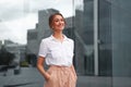 Businesswoman successful woman business person standing outdoor corporate building exterior. Smile happy caucasian confidence