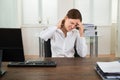 Businesswoman Suffering From Neckache At Desk Royalty Free Stock Photo