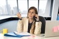 Businesswoman suffering stress at office computer desk looking w Royalty Free Stock Photo