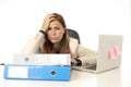 Businesswoman suffering stress at office computer desk looking worried depressed and overwhelmed Royalty Free Stock Photo