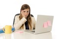 Businesswoman suffering stress at office computer desk looking worried depressed and overwhelmed Royalty Free Stock Photo