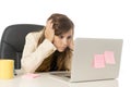 Businesswoman suffering stress at office computer desk looking worried depressed and overwhelmed Royalty Free Stock Photo