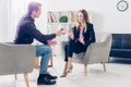 Businesswoman in suit rejecting giving interview to journalist Royalty Free Stock Photo