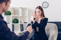 Businesswoman in suit rejecting giving interview to journalist and showing stop sign Royalty Free Stock Photo