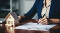 Businesswoman in a suit signing a home loan contract. AI Generated