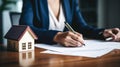 Businesswoman in a suit signing a home loan contract. AI Generated