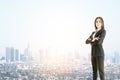 Businesswoman in a suit standing in the right, city view in the background. Boss and leader concept