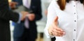 Businesswoman in suit and tie offering hand to shake to visitor Royalty Free Stock Photo