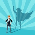 Businesswoman with superhero shadow