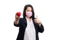 Businesswoman with surgical mask making thumb-up showing heart Royalty Free Stock Photo