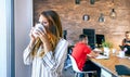 Businesswoman taking a coffee break in the office Royalty Free Stock Photo