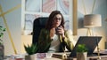 Businesswoman taking coffee break sitting office desk. Serious woman holding cup Royalty Free Stock Photo