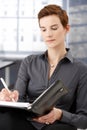 Businesswoman taking notes Royalty Free Stock Photo