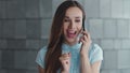 Businesswoman talking on cellphone in city. Professional celebrating success Royalty Free Stock Photo