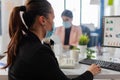 Businesswoman talking on landline phone in new normal office Royalty Free Stock Photo