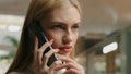 Businesswoman talking mobile phone talk telephone close up Caucasian woman lady speak cellphone with client young girl Royalty Free Stock Photo