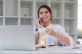 Businesswoman is talking on mobile phone in working office. beautiful of Asian woman is calling to someone on cell phone Royalty Free Stock Photo