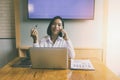 Businesswoman talking on the phone and smiling. Secretary answering her cellphone