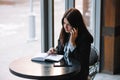 businesswoman talking on the phone and taking notes Royalty Free Stock Photo